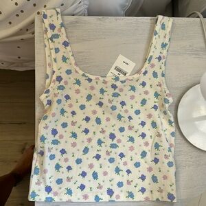 The cutest and thick strap tank in pastel flowers, brand new.